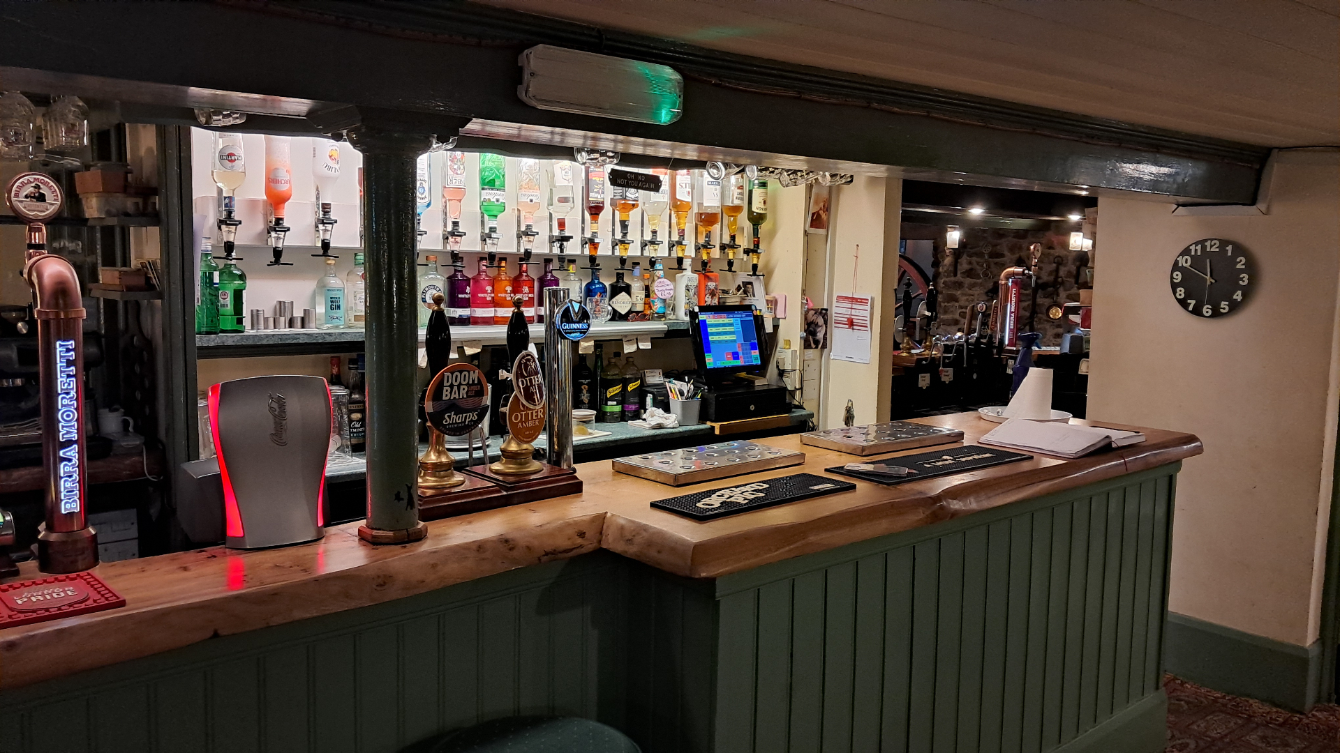 Well-stocked bar with spirits, mixers and real ale hand pumps